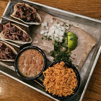 Smoky Rose - I think these were the brisket tacos. Rice and beans for the sides. - Barbeque Near Me - Dallas, Texas