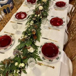 Christmas themed dinner plate, salad plate, utensils, and goblets rented