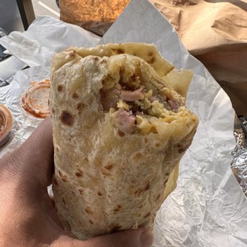 Fiesta Mexican Grille - Burrito exposing filling - Mexican Near Me - San Diego, California Fiesta Mexican Grille - Burrito exposing filling - Mexican Near Me - San Diego, California