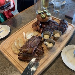 Platter with ribs, steak, sausage, and pork