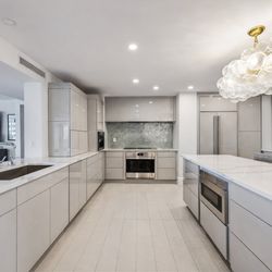 Flooring Gallery - Luxury kitchen remodel in Pelican Bay - Naples FL. Open concept kitchen with Miami style cabinets, quartz countertops and custom lighting