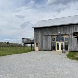 a truck parked in front of the barn