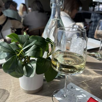 Whistling Duck - Faux plant and water bottle at each table - Wine Bars Near Me - Surfside Beach, South Carolina