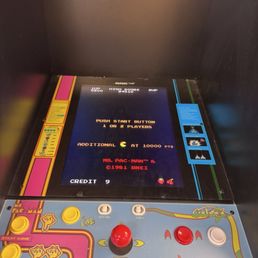 You can play Pac-Man for free while you wait for your pizza.
