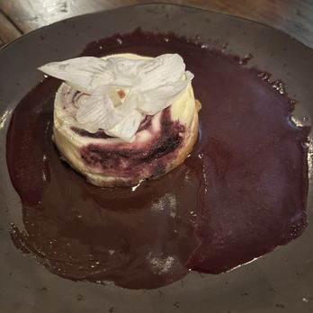 Tupelo Grille - Huckleberry cheesecake with chocolate and huckleberry sauces. - Seafood Near Me - Whitefish, Montana