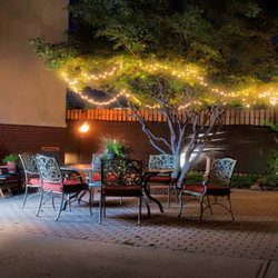 The Works - Outdoor patio seating with string lights and fire feature at The Works in Indianapolis.
