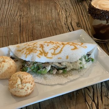 Sagrado Cafe - Breakfast Tapioca Crepe and 2 Cheese Bread, and chocolate coffee drink with dark chocolate rim - Coffee & Tea Near Me - Miami, Florida
