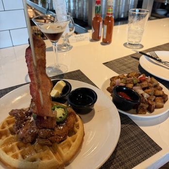 Thirsty Lion - Chicken and waffles, side of potatoes - American Near Me - The Colony, Texas Thirsty Lion - Chicken and waffles, side of potatoes - American Near Me - The Colony, Texas