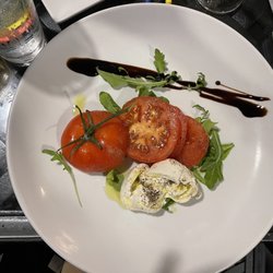 Tramici Restaurant - L CAPRESE Torn Burratta Cheese, Vine Ripened Tomatoes, Basil, Arugula, Extra Virgin Olive Oil, Toasted Ciabatta, Balsamic Reduction