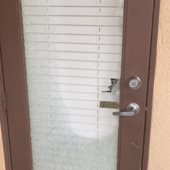 Croix Townhomes - Patio door with bullet holes in blinds - Apartments Near Me - Henderson, Nevada Croix Townhomes - Patio door with bullet holes in blinds - Apartments Near Me - Henderson, Nevada