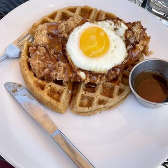 Wild Roots - Chicken and waffles with a fried egg on top - Breakfast & Brunch Near Me - West Allis, Wisconsin Wild Roots - Chicken and waffles with a fried egg on top - Breakfast & Brunch Near Me - West Allis, Wisconsin