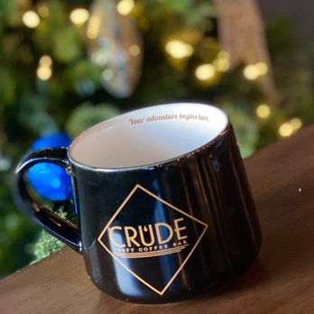 CRUDE Craft Coffee Bar - a coffee mug on a table in front of a christmas tree - Desserts Near Me - Fort Worth, Texas CRUDE Craft Coffee Bar - a coffee mug on a table in front of a christmas tree - Desserts Near Me - Fort Worth, Texas