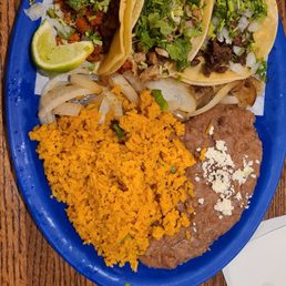 Las Tres Chismosas with your choice of meat & rice & beans Las Tres Chismosas with your choice of meat & rice & beans