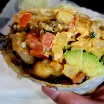 Lucha Libre - Steak, chicken, shrimp, fries, and avocado all wrapped in a tortilla blanket - Mexican Near Me - San Diego, California Lucha Libre - Steak, chicken, shrimp, fries, and avocado all wrapped in a tortilla blanket - Mexican Near Me - San Diego, California