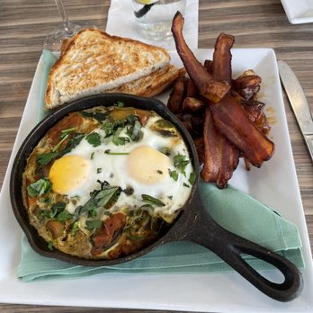 Ember & Greens - Shakshuka with bacon and toast. - New American Near Me - Houston, Texas Ember & Greens - Shakshuka with bacon and toast. - New American Near Me - Houston, Texas