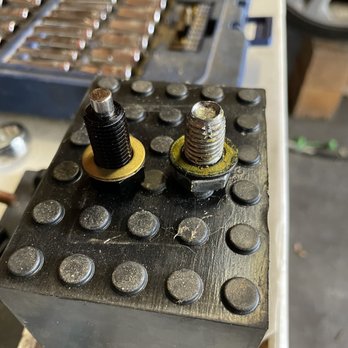 Jiffy Lube - Their "drain plug" on the right. Proper drain plug on the left. - Oil Change Stations Near Me - San Antonio, Texas