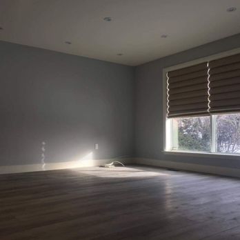 Homeview Reno - Livingroom has new ceiling and pot lights laminate floors and trim with beautiful paint - General Contractors Near Me