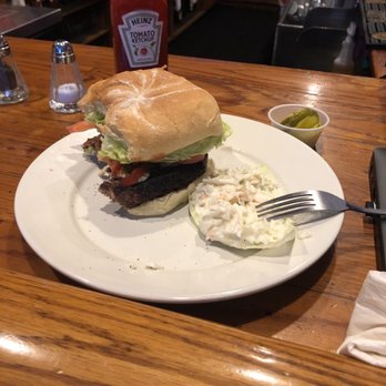 The Pub - Burger ... apologies for the missing bites. Added bacon Blue cheese and jalapeño along w tomato and lettuce. - Bars Near Me - South Windsor, Connecticut