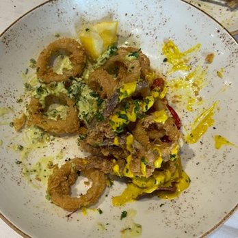 Oak & Ember Steakhouse - Calamari, charred peperonata, sweet potato chips, aji amarillo, cilantro salsa verde - Steakhouses Near Me - Stuart, Florida Oak & Ember Steakhouse - Calamari, charred peperonata, sweet potato chips, aji amarillo, cilantro salsa verde - Steakhouses Near Me - Stuart, Florida