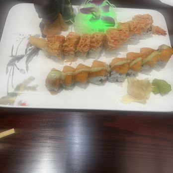 Yama Sushi Bar - Kally roll and Goldfish roll with a little cute black buddah baby - Sushi Bars Near Me - Glen Burnie, Maryland Yama Sushi Bar - Kally roll and Goldfish roll with a little cute black buddah baby - Sushi Bars Near Me - Glen Burnie, Maryland