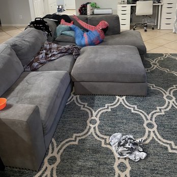 Pinks Carpet and Tile Cleaning - Before picture... ignore the Spider-Man. But zoom in on the stains in the couch to the left. - Carpet Cleaning Near Me Pinks Carpet and Tile Cleaning - Before picture... ignore the Spider-Man. But zoom in on the stains in the couch to the left. - Carpet Cleaning Near Me