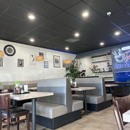 Dining area on one side  and pick up counter. Very clean and inviting.