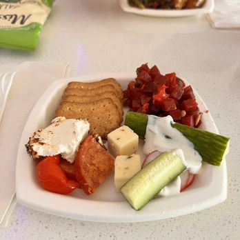 Delta Sky Club - a plate of food on a table - Airport Lounges Near Me - West Palm Beach, Florida Delta Sky Club - a plate of food on a table - Airport Lounges Near Me - West Palm Beach, Florida
