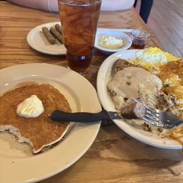 Pancake, extra butter, 4 sausage links, fried chicken fried with gravy, hashbrowns, eggs, and raspberry brisk tea Pancake, extra butter, 4 sausage links, fried chicken fried with gravy, hashbrowns, eggs, and raspberry brisk tea