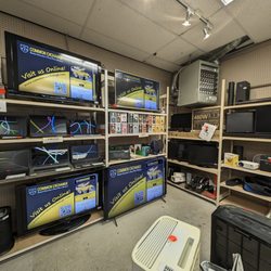 Common Exchange - Part of the electronics section of retail, showcasing a wide range of laptops and TVs, as well as collectibles for sale!