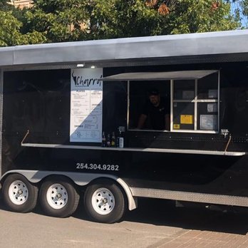 Charrdtx - a black food truck parked in a parking lot - Food Trucks Near Me - Waco, Texas