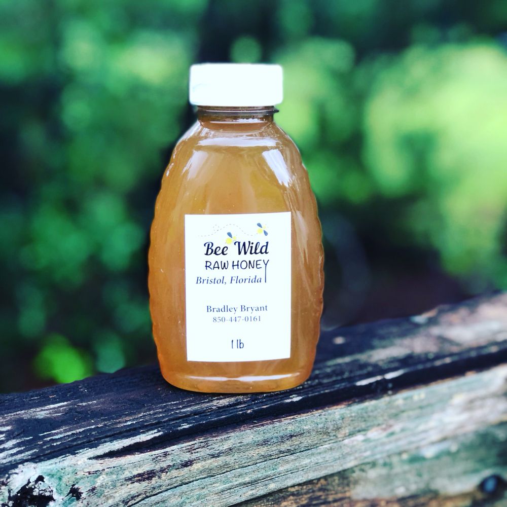 Bee Wild Raw Honey Logo