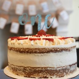 Vanilla cake with strawberry filling, topped with strawberries (all organic), sweetened only with pure maple syrup.