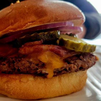 Liberty Burger - a closeup of a hamburger on a plate - Burgers Near Me - Bozeman, Montana