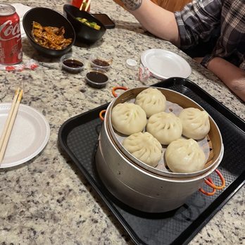 Legend Dumpling And Bao - a man sitting at a table - Poke Near Me - Chicago, Illinois