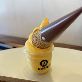 Nobibi - Mango soft serve with waffle cone in a cup - Ice Cream & Frozen Yogurt Near Me - San Diego, California Nobibi - Mango soft serve with waffle cone in a cup - Ice Cream & Frozen Yogurt Near Me - San Diego, California