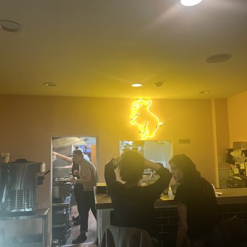 Tabachoy - Tabachoy fluorescent pic. Dining area and counter. Also there is a soft serve ice cream machine for the ube sundaes - Filipino Near Me - Philadelphia, Pennsylvania