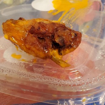 Epic Wings - It's black on the inside and burnt not sure how the outside looks good but burnt on the inside - Chicken Wings Near Me - Oceanside, California