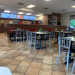 ows tables and chairs in a restaurant