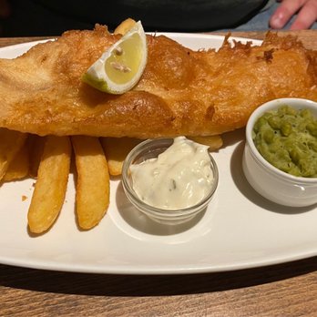 St Stephen's Tavern - Forum Lager Battered Fish & Chips tartare sauce, crushed peas & mint, or mushy peas, triple cooked chips; lemon - Fish & Chips Near Me - London, XGL St Stephen's Tavern - Forum Lager Battered Fish & Chips tartare sauce, crushed peas & mint, or mushy peas, triple cooked chips; lemon - Fish & Chips Near Me - London, XGL