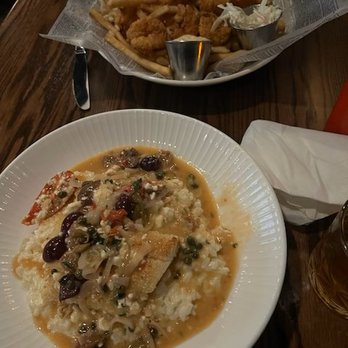 Dockside Pub - Bottom is Mediterranean Haddock on parmesan risotto--top is fried shrimp & scallops - Bars Near Me - Swampscott, Massachusetts