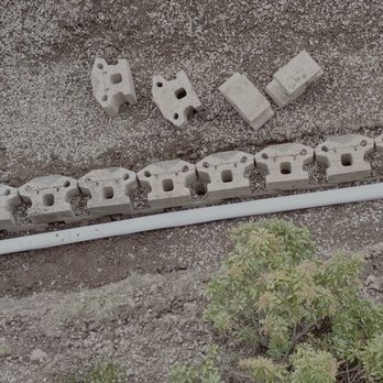 Charles & Son Construction & Landscaping - Drainage pipe with gravel. - Landscaping Near Me - West Orange, New Jersey