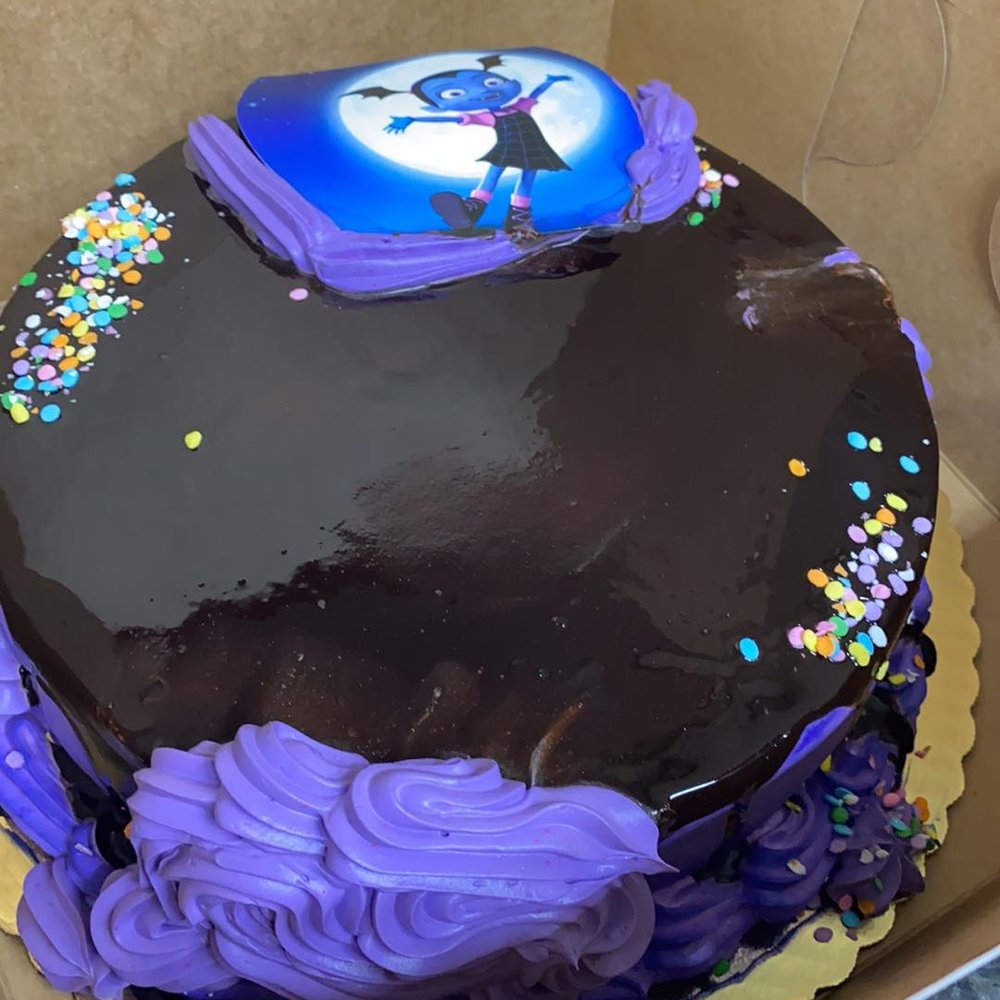 Rosy's Bakery - a chocolate cake with purple frosting and sprinkles - Bakeries Near Me - Chicago, Illinois Rosy's Bakery - a chocolate cake with purple frosting and sprinkles - Bakeries Near Me - Chicago, Illinois