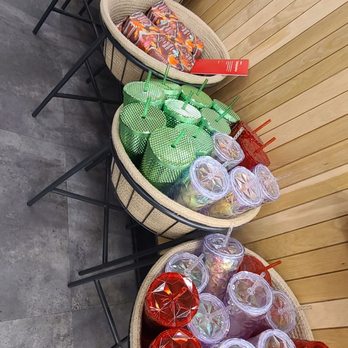 Starbucks - a row of plastic cups on a table - Coffee & Tea Near Me - Fallon, Nevada