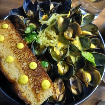 Aster - Mussels with coconut curry broth - Salad Near Me - Midland, Michigan