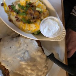 Bozeman Trail Steakhouse - Chicken fried steak with loaded baked potato.