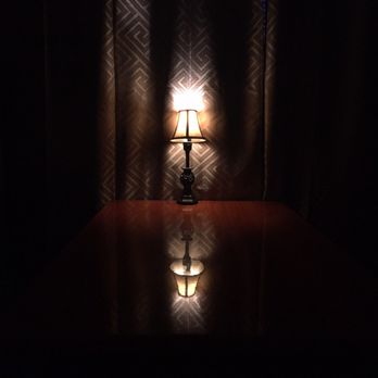 The Monkey Club - a lamp on a table in the dark - Dive Bars Near Me - Philadelphia, Pennsylvania