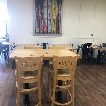 Tropical Smoothie Cafe - Nice table and chairs- look what is written on the back of the chairs - Juice Bars & Smoothies Near Me - Tuscaloosa, Alabama