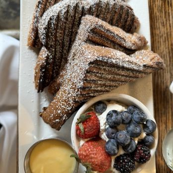 Russell's on Macklind - Grilled French Toast - Vanilla and Cinnamon Custard Soaked Country Butter-Top Bread, Lemon Curd, Whipped Cream, Fresh Berries - Cafes Near Me - Saint Louis, Missouri Russell's on Macklind - Grilled French Toast - Vanilla and Cinnamon Custard Soaked Country Butter-Top Bread, Lemon Curd, Whipped Cream, Fresh Berries - Cafes Near Me - Saint Louis, Missouri