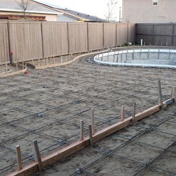 Rebar and shaping ready for cement. The long 2x4 is holding the deck drain.