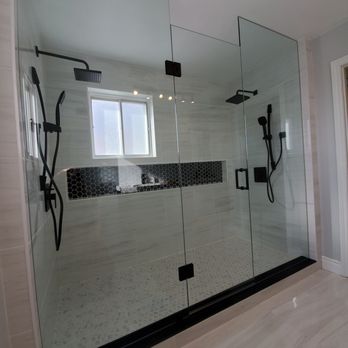 Reno Legends - a walk in shower with a glass door - General Contractors Near Me - East York, Ontario Reno Legends - a walk in shower with a glass door - General Contractors Near Me - East York, Ontario